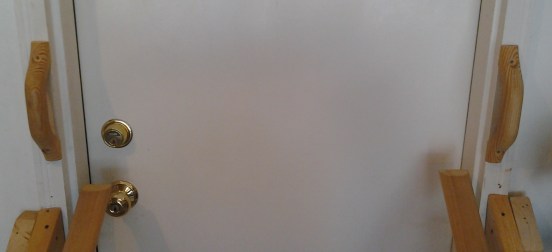 The handles Priscilla attached to the sides of our garage door. (The railings were added later.)