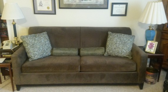 The bolsters (center), wearing the covers Priscilla made for them. (The watercolor painting at the right is by Priscilla as well.)