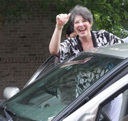 Priscilla waves goodbye to our friends as we get into the car to head back across town.
